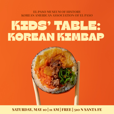 Kimbap being held by chopsticks.